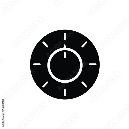 Black circular dial with white markings and pointer