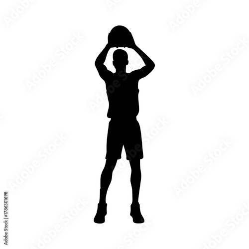 Silhouette of a basketball player in mid jump shooting the ball against a white background