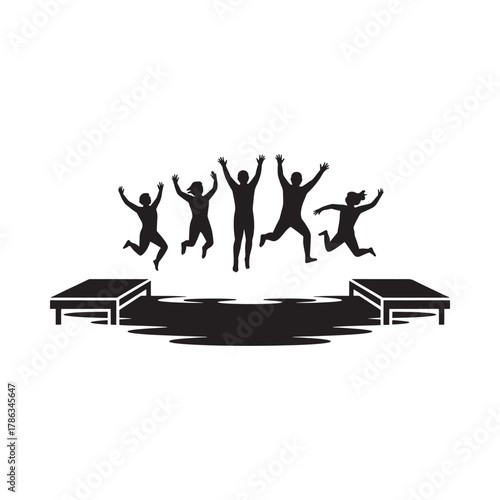 Silhouettes of people jumping for joy on a stage