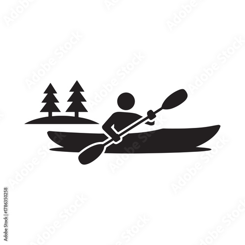 Silhouette of a person kayaking with trees in the background