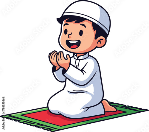 Cute cartoon Muslim boy in white thobe and kufi cap, smiling happily while kneeling in prayer on a red and green prayer mat, perfect for themes of faith, worship, and cultural education.