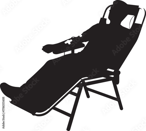 Silhouette of a relaxed person lounging in a reclining outdoor chair enjoying leisure time