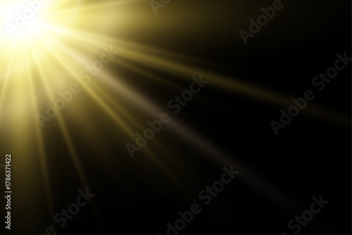 Powerful golden sunbeam. a corner dramatic illumination light design element. abstract radial light sunburst flare against a contrasting deep black backdrop.