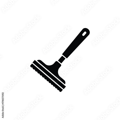 Black silhouette of a scraper tool cleaning object