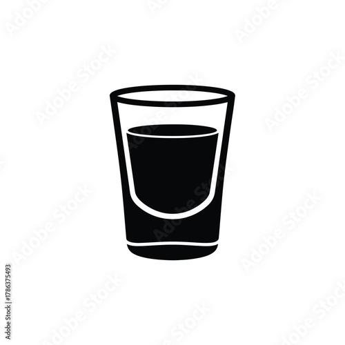 Black silhouette of a shot glass filled with dark liquid