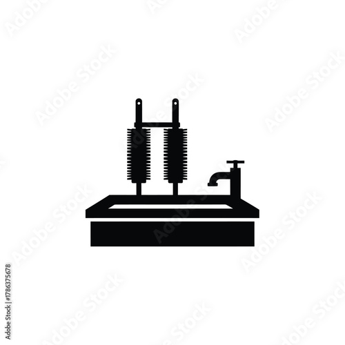 Black silhouette of a sink with brushes and faucet