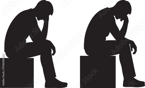 Two men sitting in thought silhouette