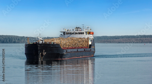 Timber cargo ship on the River Svir in the north-east of Leningrad Oblast, Russia. It flows  from Lake Onega to Lake Ladoga, connecting the two largest lakes of Europe.
