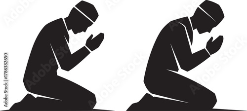Two men praying in silhouette