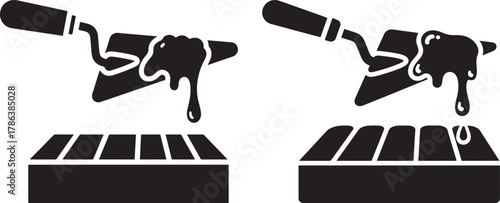 Trowel spreading mortar on bricks silhouette