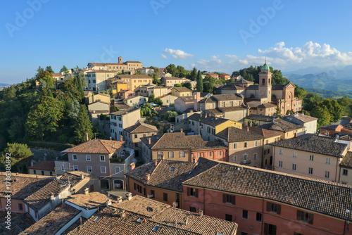 Colorful buildings and historic tower in the medieval town of Verucchio, Emilia-Romagna, Italy.