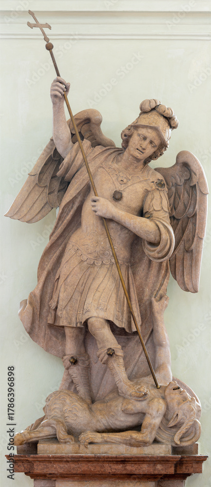 Fototapeta premium SALZBURG, AUSTIRA - SEPTEMBER 7, 2025: The marble statue of St. Michael Archangel in the church Erzabtei St. Peter by unknown artist. 