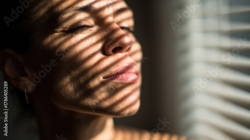 Woman looking up toward sun...