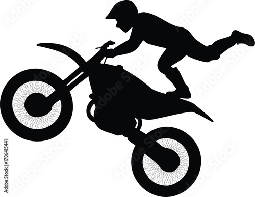 Silhouette of a drit bike jumpping Motorcross Daredevil Capturing the moment a motorcross rider fearlessly executes a gravity defying stunt a silhouette of power skill, and daring in motion.