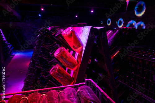 Aging and riddling of wine in champagne bottles in caves, traditional method of production of cremant, blanquette sparkling wine Limoux, Occitania, France