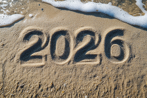 Beach Scene with 2026 Written in Sand and Incoming Waves	