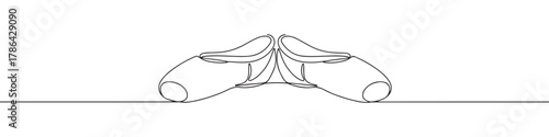 A pair of elegant ballet pointe shoes with ribbons, drawn in a graceful continuous line art style