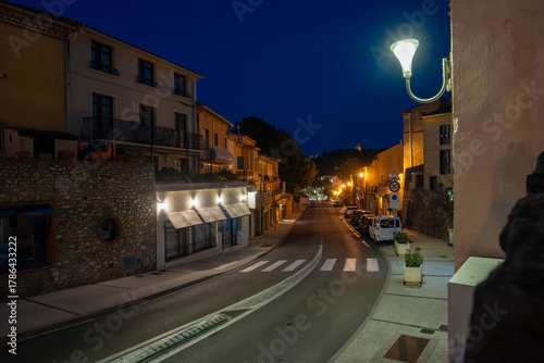 Fototapeta Naklejka Na Ścianę i Meble -  Panoramic view of colourful Collioure at night, narrow streets and yellow, pink, orange houses, historical buidings and beaches, Pyrenees-Orientales, France