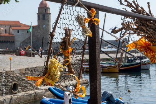 Fototapeta Naklejka Na Ścianę i Meble -  View of colourful Collioure, narrow streets and yellow, pink, orange houses, summer vacation destination town with historical buidings and beaches, Pyrenees-Orientales, France