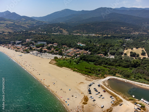Aerial view on sea with white sandy beaches near Collioure, Cote Vermeille, Pyrenees-Orientales, Occitania, France. Le Racou beach, summer vacation destination