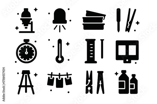 Darkroom Tools Icons. Darkroom Tools. Solid icons set of Darkroom Tools: enlarger, safe light, trays, tongs, timer, thermometer, graduated cylinder, negative