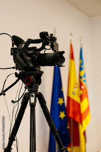 Video camera recording a press conference
