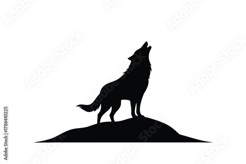 Silhouette of a wolf howling at the sky while standing on a hill appears