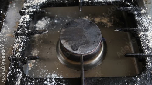 Dirty gas burner in the kitchen.