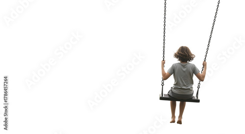 Child with brown hair wearing a grey t-shirt and shorts sitting on a swing isolated on a transparent background
