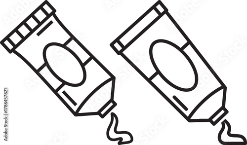 Two artistic paint tubes squeezing out colorful art supplies silhouette