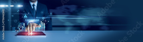 Businessman using tablet analyzing e-governance and growth graph chart, digital administration, online services, transparency, citizen engagement, data management, smart government innovation.