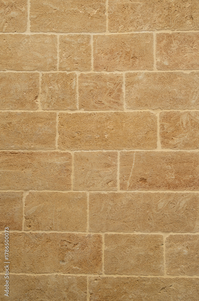 Fototapeta premium New yellow stone wall closeup in Lecce, Italy