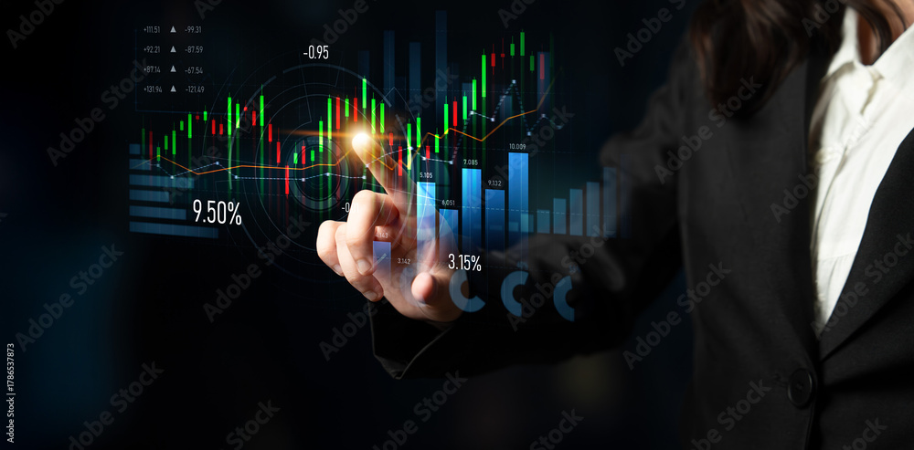 Obraz premium Professional interacts with a digital financial display, showcasing market trends and analytics, emphasizing data-driven decision-making in business environments. Scalp