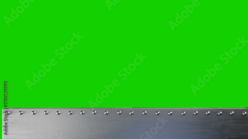 Steampunk iron background with borders and rivets. Iron bunker with an embrasure or window. Isolated with green chromakey, luma matte.