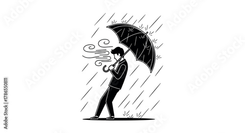 Stressed young caucasian male struggling against strong winds and heavy rain while holding an umbrella.