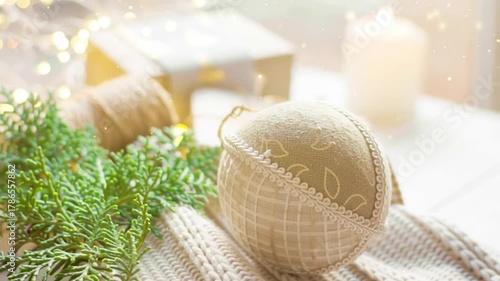 Video Christmas decoration gift boxes burning candle by the window in cozy home atmosphere
