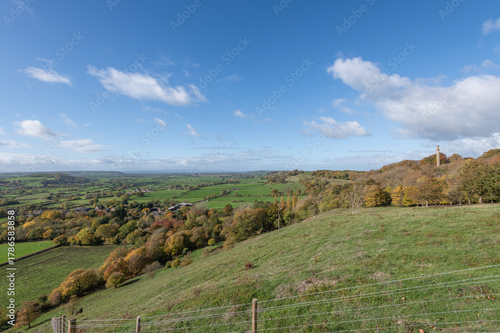 Naklejka premium Landscape photo of the autumn colours at Admiral Hood Monument overlooking the village of Compton Dundon in somerset