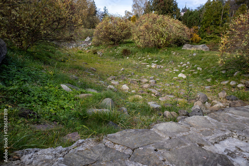 Dry stone creek bed in autumn parkland