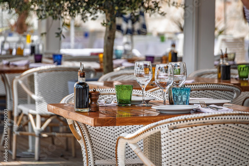 Fototapeta Naklejka Na Ścianę i Meble -  Al fresco tables waiting for customers at an outdoor restaurant in Nice, France