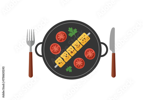 Overhead view of a black skillet with grilled tofu skewer tomatoes and parsley