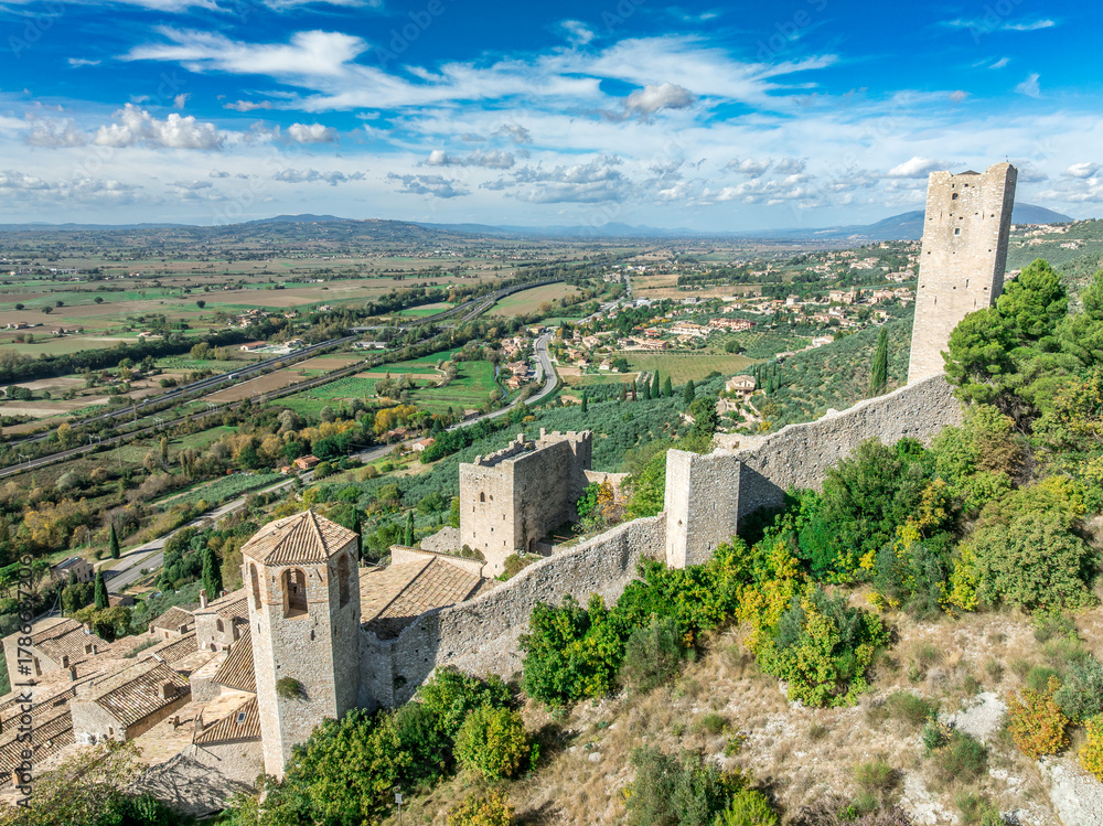 Fototapeta premium Aerial view of Pissignano: A Beautifully Restored Medieval Hilltop Hamlet in Umbria, Home to the Ancient Temple of Clitumnus
