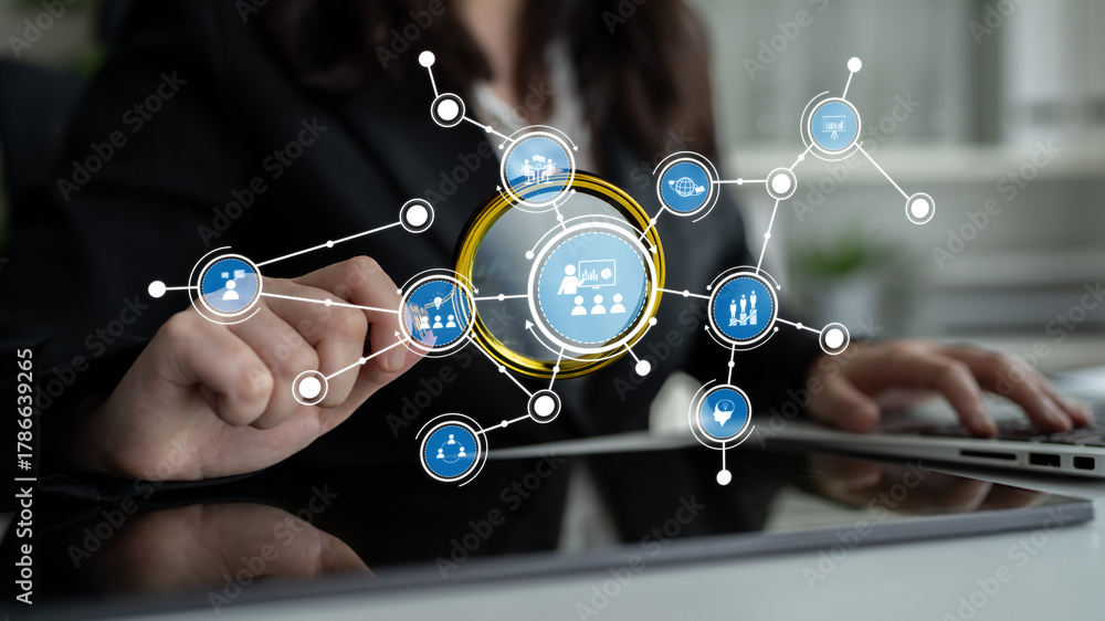 Obraz premium A business professional engages with a digital interface on a touchscreen in a modern office, showcasing connectivity and collaboration in the workplace. Tessel