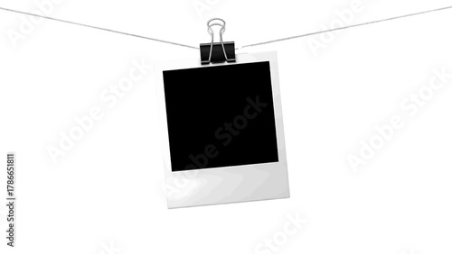 Vector illustration of a single instant photo frame clipped to a string on a white background