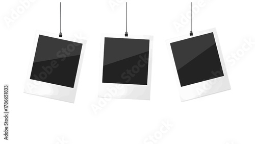Vector illustration of three instant photo frames hanging on a string on a white background