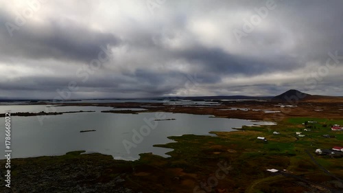 Drone 4k view of flying backwards over Grjotagja lava field near Lake Myvatn in North Iceland, famous destination for geothermal hot spring