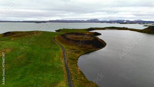 4K drone aerial footage over volcanic pseudo craters Skutustadagigar in lake Myvatn. Huge cones of pseudo craters on the Icelandic shore.