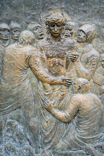 Station X: Jesus is stripped of his garments (Division of robes). The Way of the Cross on Mount Križevac (the Cross Mountain) in Medjugorje.