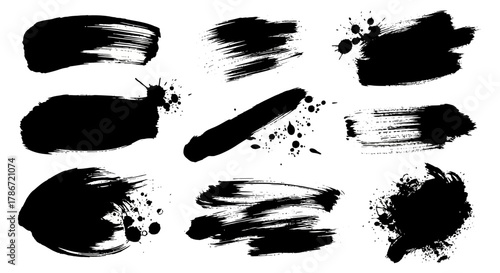 Black ink brush strokes and splatters for artistic design elements and textures