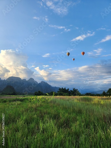 Sunset Over Green Rice Fields and Limestone Mountains in Vang Vieng Laos