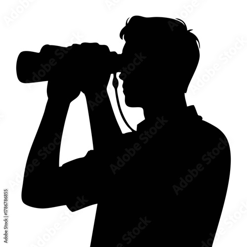 silhouette of a person using binoculars